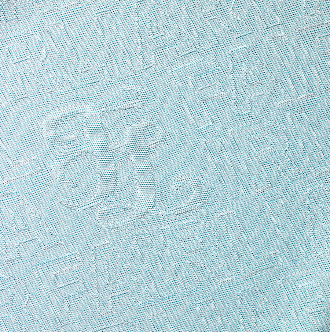 Women's monogram embossed mock neck top by Fairliar