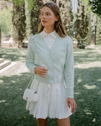 Women's white polo blouse with bow detail by Fairliar